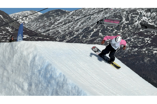 Snowboarder flies into the air doing cool tricks